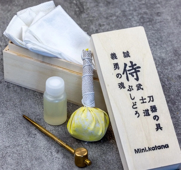 A katana care set with oil, powder ball and wooden box